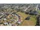Residential area with homes, green spaces, and a tranquil pond at 8183 Westmont Terrace Dr, Lakeland, FL 33810