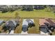 Three homes with gray, gray, and brown roofs, situated side by side at 8183 Westmont Terrace Dr, Lakeland, FL 33810