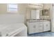 Bathroom boasts double vanity and corner soaking tub at 8183 Westmont Terrace Dr, Lakeland, FL 33810