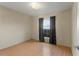 Simple bedroom with hardwood floors and large window at 8183 Westmont Terrace Dr, Lakeland, FL 33810