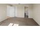 Primary bedroom with carpet flooring and access to bathroom at 8183 Westmont Terrace Dr, Lakeland, FL 33810