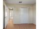 Bedroom with hardwood floors and double door closet at 8183 Westmont Terrace Dr, Lakeland, FL 33810