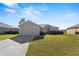 Single-story house with attached garage and a spacious lawn at 8183 Westmont Terrace Dr, Lakeland, FL 33810