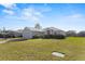 Well-maintained home with a large front yard, mature landscaping, and an attached two-car garage at 8183 Westmont Terrace Dr, Lakeland, FL 33810