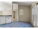 Kitchen nook with blue tile floor and view into adjacent living area at 8183 Westmont Terrace Dr, Lakeland, FL 33810