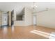 Bright and airy living room featuring hardwood floors and natural light, adjacent to dining area at 8183 Westmont Terrace Dr, Lakeland, FL 33810