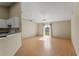 Bright living room with sliding glass doors to backyard, hardwood floors, and chandelier at 8183 Westmont Terrace Dr, Lakeland, FL 33810