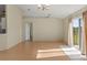 Living room with hardwood floors and access to other rooms at 8183 Westmont Terrace Dr, Lakeland, FL 33810
