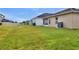 Features a spacious backyard with a large grassy area at 1034 Corso Dr, Winter Haven, FL 33884