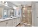 Double vanity bathroom with a walk-in shower at 1034 Corso Dr, Winter Haven, FL 33884