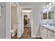 Bathroom with toilet and walk-in closet at 1034 Corso Dr, Winter Haven, FL 33884