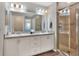 Double vanity bathroom with a walk-in shower at 1034 Corso Dr, Winter Haven, FL 33884