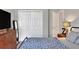 Bedroom with a queen bed and double door closet at 1034 Corso Dr, Winter Haven, FL 33884