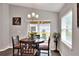 Bright dining room with table and chairs near sliding door at 1034 Corso Dr, Winter Haven, FL 33884