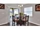 Bright dining room with table and chairs near sliding door at 1034 Corso Dr, Winter Haven, FL 33884