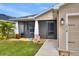 One story house with screened porch and well-maintained lawn at 1034 Corso Dr, Winter Haven, FL 33884