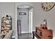 Clean hallway with wood-look floors and decorative accents at 1034 Corso Dr, Winter Haven, FL 33884