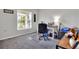Bright home office features a desk, window, and carpeted floor at 1034 Corso Dr, Winter Haven, FL 33884