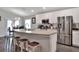 Modern kitchen with stainless steel appliances and an island at 1034 Corso Dr, Winter Haven, FL 33884
