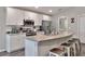 Modern kitchen with stainless steel appliances and an island at 1034 Corso Dr, Winter Haven, FL 33884