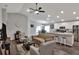 Open concept living room and kitchen with modern appliances and furniture at 1034 Corso Dr, Winter Haven, FL 33884