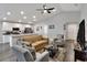 Open living room with vaulted ceilings, neutral walls, and modern furnishings at 1034 Corso Dr, Winter Haven, FL 33884
