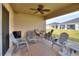 Relaxing screened porch with seating and ceiling fan at 1034 Corso Dr, Winter Haven, FL 33884