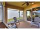 Screened porch with seating area and access to backyard at 1034 Corso Dr, Winter Haven, FL 33884