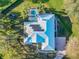House with pool and solar panels, top-down view at 111 Arbor Way, Auburndale, FL 33823