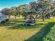 Large backyard with trampoline and playset at 111 Arbor Way, Auburndale, FL 33823