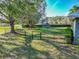 Backyard with playset, trampoline, and fenced area at 111 Arbor Way, Auburndale, FL 33823