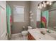 Bathroom with tub shower combination and colorful accents at 111 Arbor Way, Auburndale, FL 33823