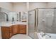 Bathroom with double vanity, soaking tub, and walk-in shower at 111 Arbor Way, Auburndale, FL 33823