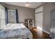 Bright bedroom with a comfortable bed and wood floors at 111 Arbor Way, Auburndale, FL 33823
