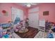 bedroom with toys, books, and a work space at 111 Arbor Way, Auburndale, FL 33823