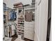 Organized walk-in closet with shelving and drawers at 111 Arbor Way, Auburndale, FL 33823