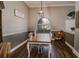 Charming dining room with hardwood floors, a wood table, and an arched window at 111 Arbor Way, Auburndale, FL 33823