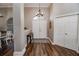 Bright entryway with hardwood floors, double doors, and a console table at 111 Arbor Way, Auburndale, FL 33823