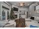 Gathering room with a fireplace, built-in shelves, and a large sectional sofa at 111 Arbor Way, Auburndale, FL 33823