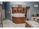 Kitchen features wood cabinets, granite countertops, and stainless steel appliances at 111 Arbor Way, Auburndale, FL 33823