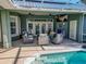 Spacious covered patio with seating and outdoor TV at 111 Arbor Way, Auburndale, FL 33823