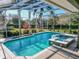 Relaxing screened pool and spa with a view of the yard at 111 Arbor Way, Auburndale, FL 33823