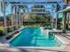 Inviting screened pool area with spa and lush landscaping at 111 Arbor Way, Auburndale, FL 33823