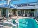 Large pool and spa with patio furniture and a grill at 111 Arbor Way, Auburndale, FL 33823
