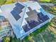 Solar panels on a metal roof next to a pool at 111 Arbor Way, Auburndale, FL 33823
