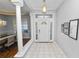 Bright entryway with tile floors and columns at 1520 Royal Forest Loop, Lakeland, FL 33811