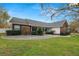 Brick house with a well-maintained lawn and landscaping at 1520 Royal Forest Loop, Lakeland, FL 33811