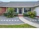 Landscaped front yard with walkway to entryway at 1520 Royal Forest Loop, Lakeland, FL 33811