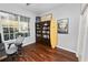 Bright home office features built-in shelving and hardwood floors at 1520 Royal Forest Loop, Lakeland, FL 33811