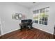 Home office with hardwood floors and a large window at 1520 Royal Forest Loop, Lakeland, FL 33811
